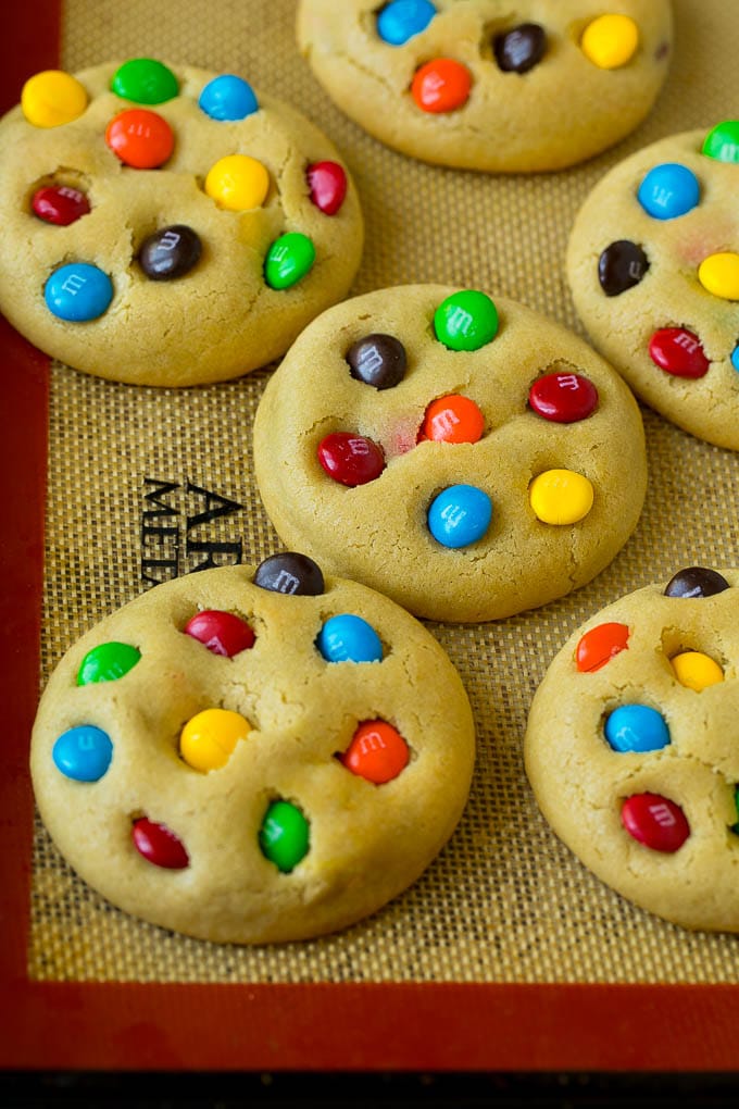 M&M Cookies Recipe #cookies #chocolate #baking #dessert #sweets #edsug Baked cookies on a sheet pan.