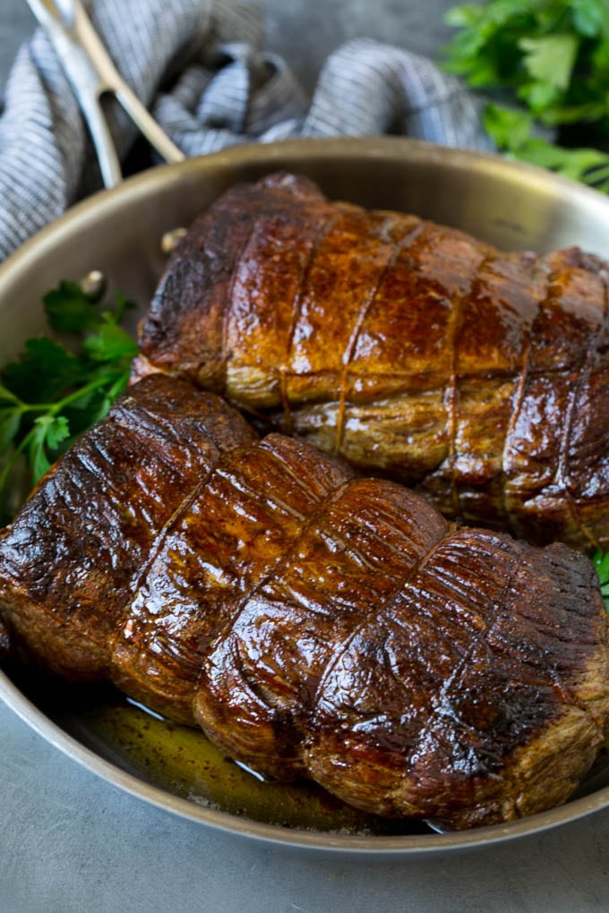 Beef Tenderloin with Garlic Butter #beef #steak #dinner #edsug Roasted garlic butter beef tenderloin in a pan.