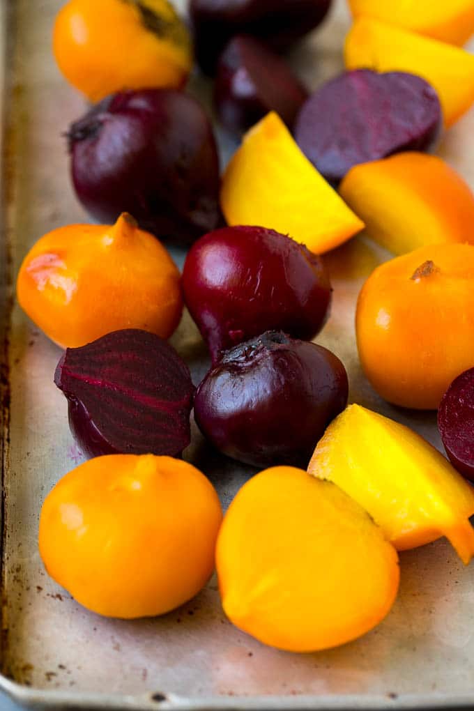 Beet Salad Recipe #beets #avocado #feta #salad #dinner #edsug Roasted red and yellow beets on a sheet pan.