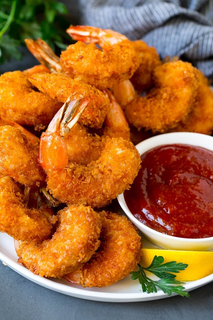 Fried Shrimp Recipe #shrimp #seafood #dinner #appetizer #edsug A plate of fried shrimp served with cocktail sauce.