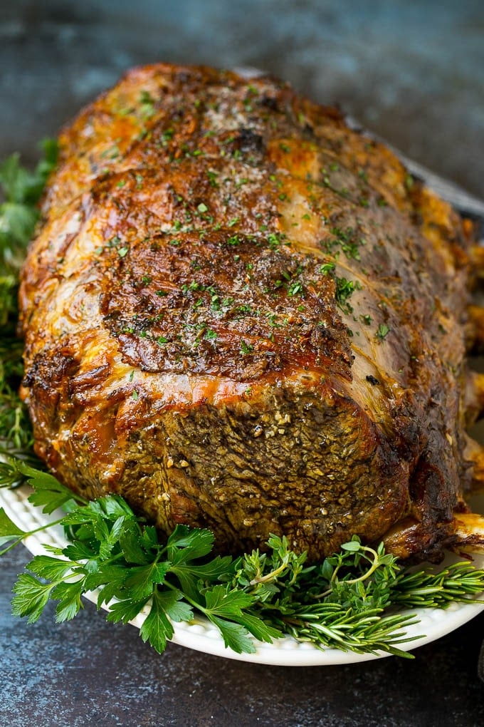 Prime Rib Recipe #primerib #beef #roast #dinner #thanksgiving #christmas #keto #lowcarb #edsug A slow roasted prime rib on a serving platter.