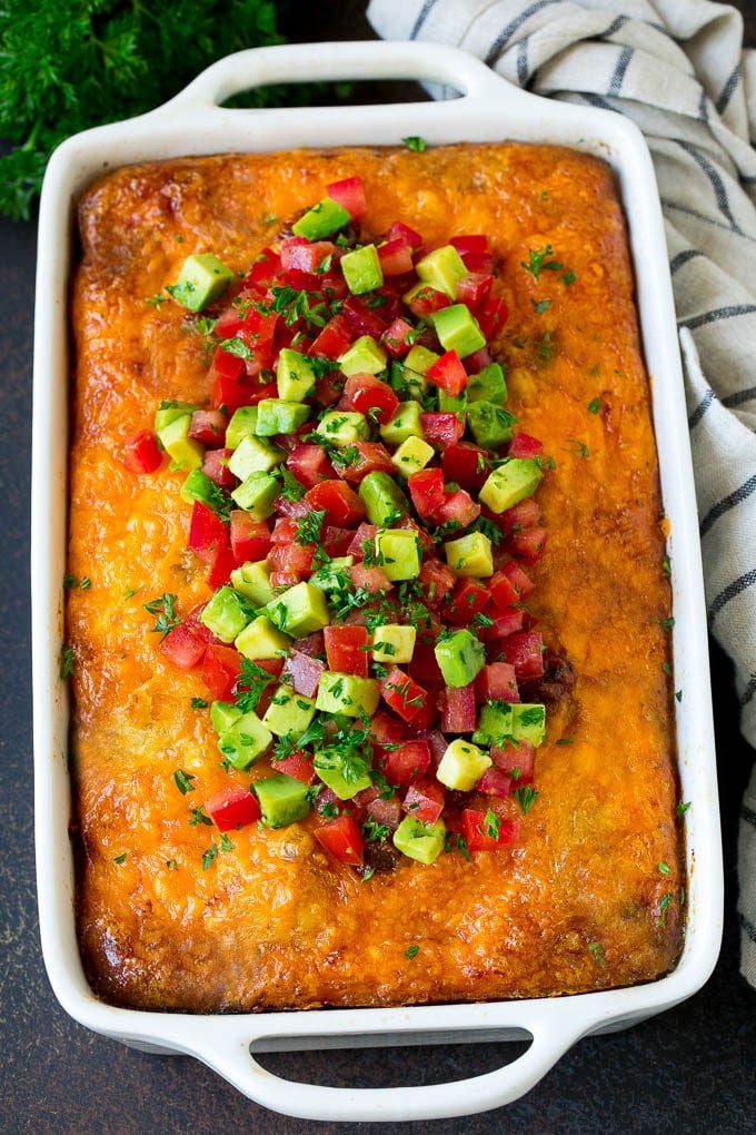 Sausage Egg Casserole Recipe | Egg Casserole #eggs #sausage #potato #cheese #casserole #breakfast #brunch #edsug Sausage egg casserole topped with avocado and tomato.