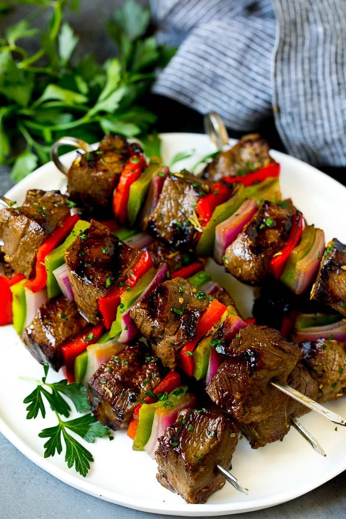 Beef Shish Kabobs Recipe | Beef Kabobs #grilling #beef #steak #dinner #edsug #peppers Shish kabob made with beef, peppers and onions on a serving plate.