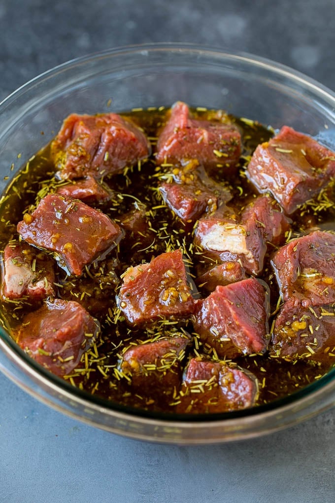 Beef Shish Kabobs Recipe | Beef Kabobs #grilling #beef #steak #dinner #edsug #peppers Steak cubes in a bowl of marinade.