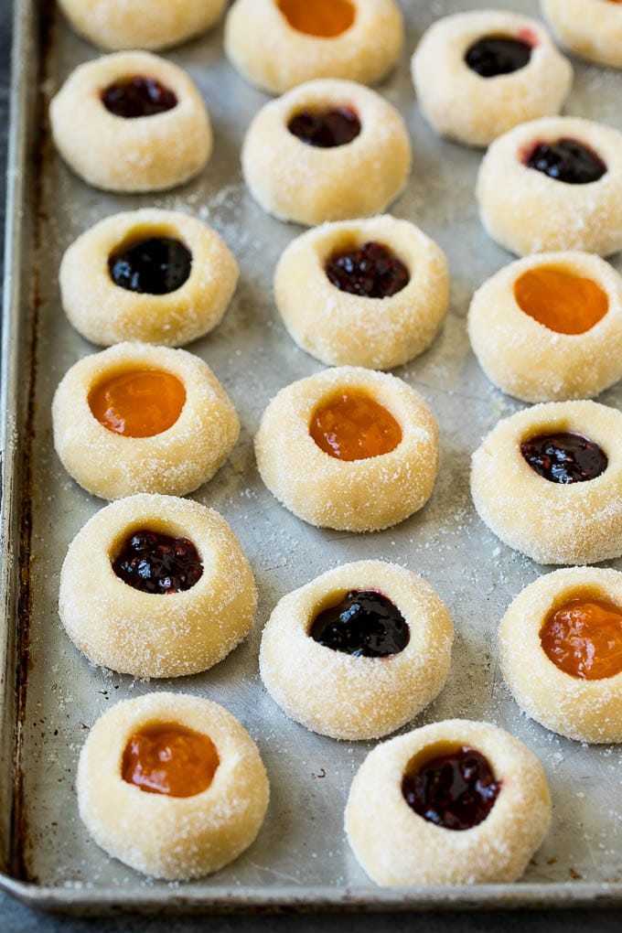 Thumbprint Cookies | Sugar Cookies #cookies #baking #christmas #dessert #edsug Cookie dough filled with fruit jam.