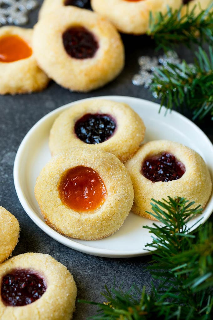 Thumbprint Cookies | Sugar Cookies #cookies #baking #christmas #dessert #edsug A plate of jam filled thumbprint cookies.