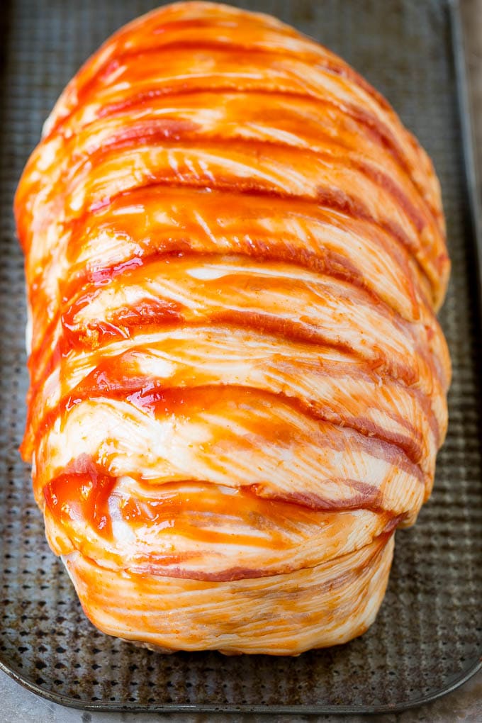 Bacon Wrapped Meatloaf Recipe | Beef Meatloaf #meatloaf #beef #groundbeef #bacon #dinner #edsug Raw slices of bacon wrapped around a seasoned ground beef loaf.