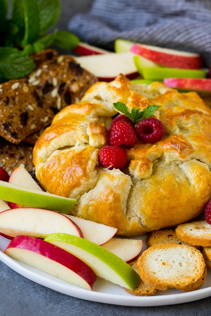 Baked Brie Recipe | Pastry Wrapped Brie #brie #cheese #appetizer #pecans #raspberries #edsug Brie wrapped in puff pastry, served with apples and crackers.