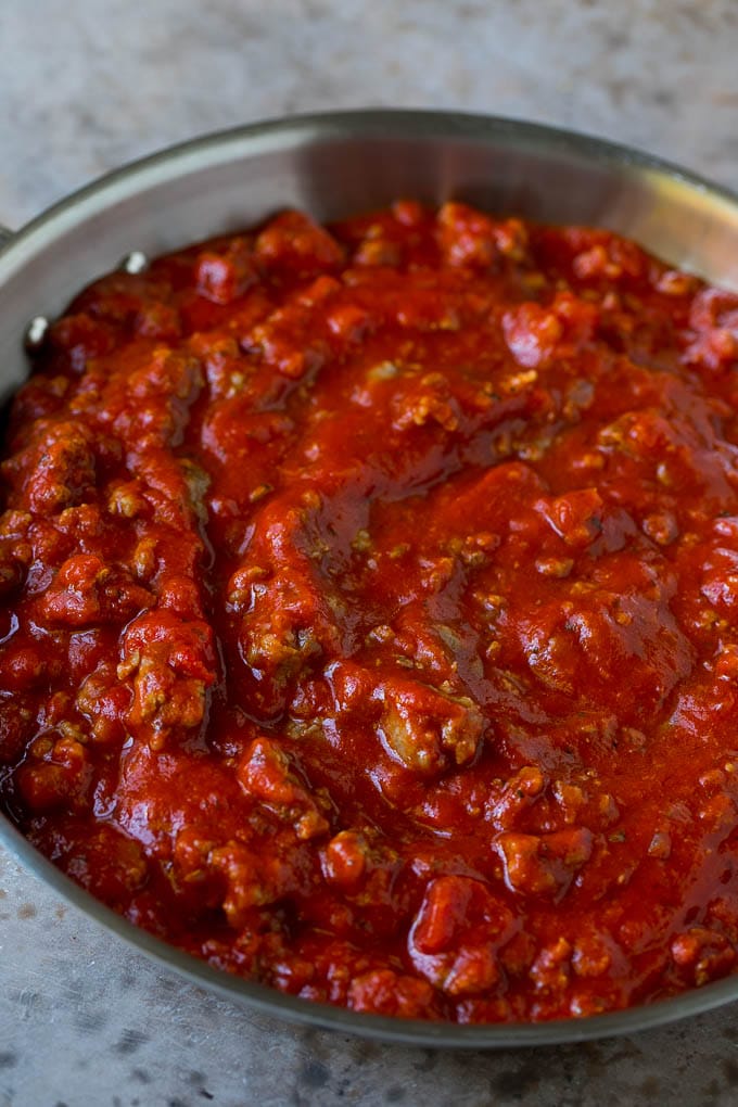 Baked Spaghetti Recipe | Baked Pasta #spaghetti #pasta #cheese #casserole #beef #sausage #dinner #edsug Meat sauce in a skillet.