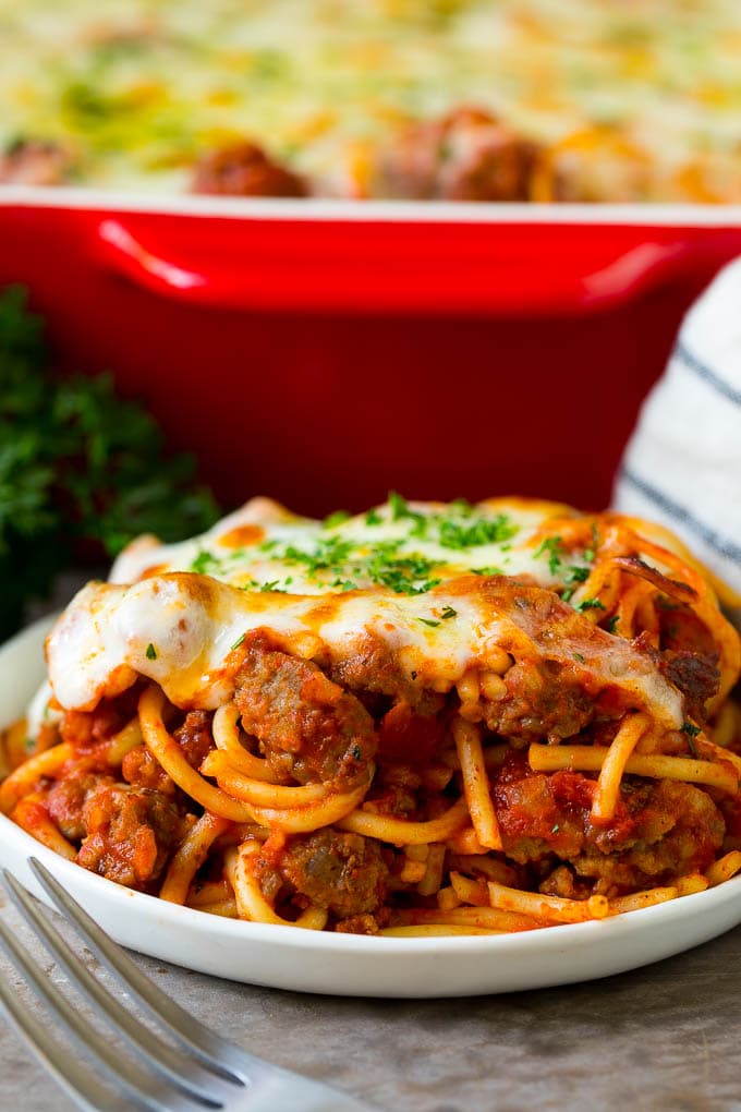 Baked Spaghetti Recipe | Baked Pasta #spaghetti #pasta #cheese #casserole #beef #sausage #dinner #edsug A serving of baked spaghetti topped with melted cheese.