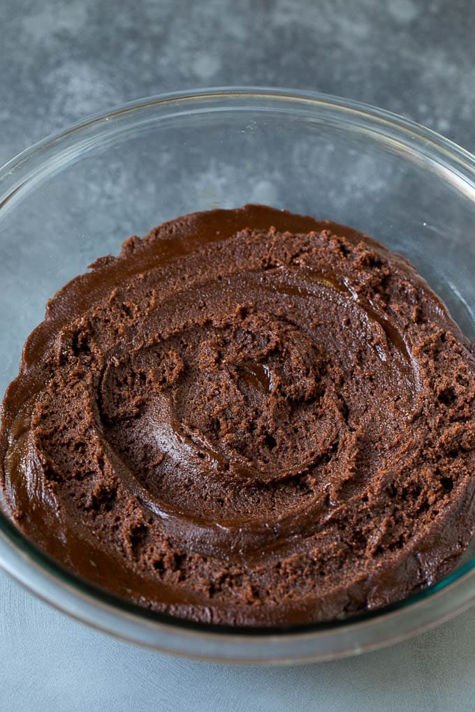Chocolate Crinkle Cookies Recipe #cookies #chocolate #christmas #dessert #baking #edsug A bowl of chocolate cookie dough.