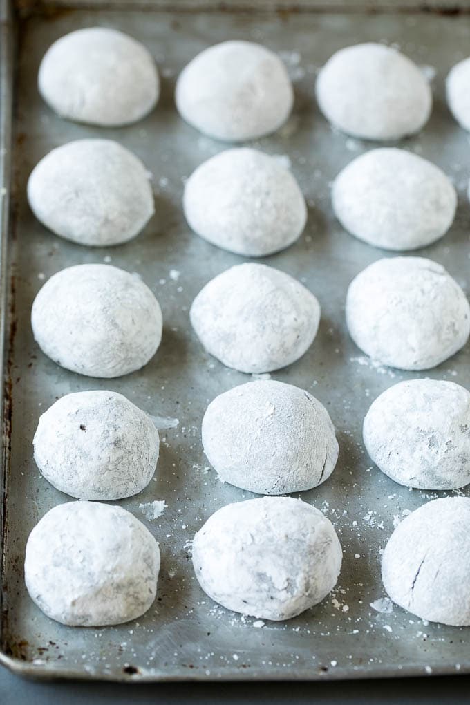 Chocolate Crinkle Cookies Recipe #cookies #chocolate #christmas #dessert #baking #edsug Balls of cookie dough rolled in powdered sugar.