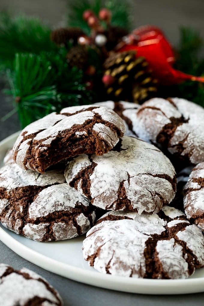Chocolate Crinkle Cookies Recipe #cookies #chocolate #christmas #dessert #baking #edsug A plate of chocolate crinkle cookies.