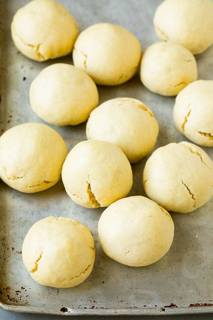 Italian Cookies Recipe | Almond Cookies #cookies #italianfood #frosting #sprinkles #baking #christmas #edsug Baked almond cookies on a baking sheet.