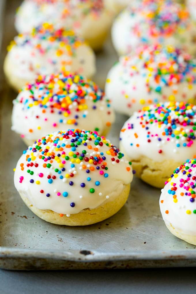 Italian Cookies Recipe | Almond Cookies #cookies #italianfood #frosting #sprinkles #baking #christmas #edsug Italian cookies covered in frosting and rainbow sprinkles.