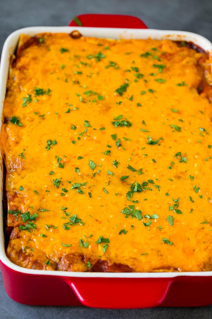 Mexican Lasagna Recipe | Mexican Casserole #mexican #lasagna #groundbeef #beans #dinner #cheese #edsug A baked Mexican casserole topped with melted cheese and cilantro.