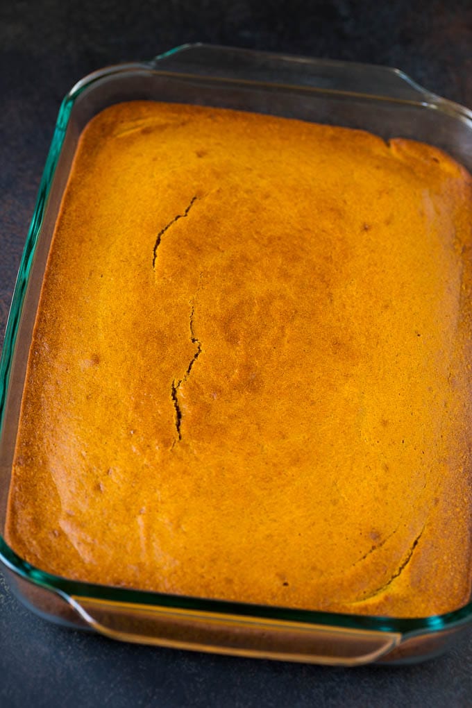 Pumpkin Cake Recipe | Pumpkin Spice Cake #cake #pumpkin #dessert #baking #fall #thanksgiving #edsug A baked base in a glass dish ready for frosting.