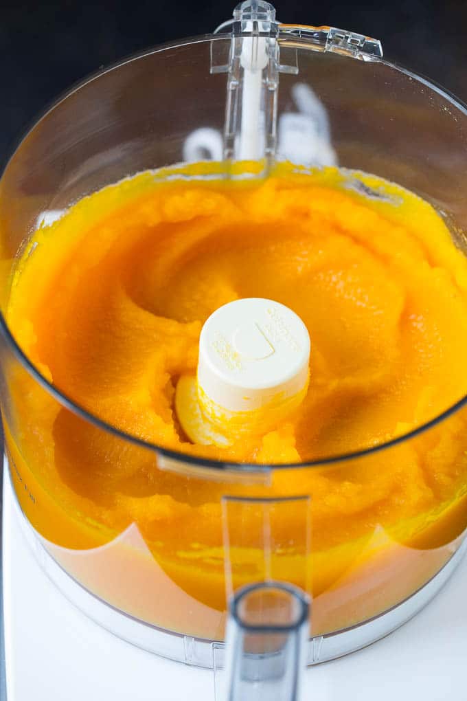 Pumpkin Puree Recipe #pumpkin #baking #fall #thanksgiving #edsug Pureed pumpkin in a food processor.