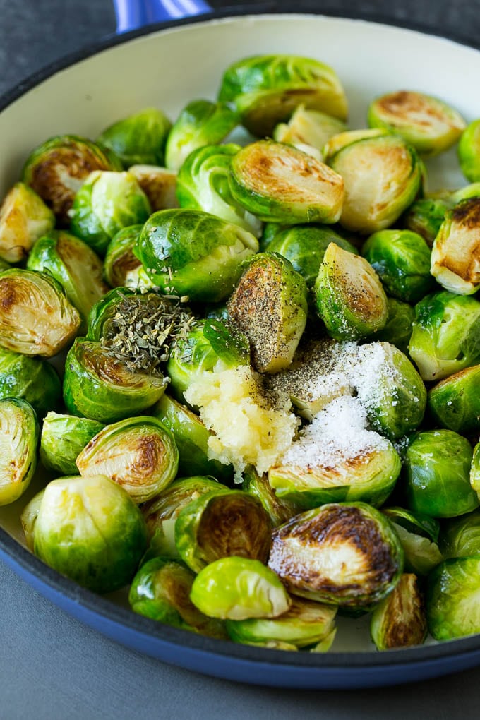 Sauteed Brussels Sprouts Recipe | Brussels Sprouts Side Dish #brusselssprouts #sprouts #veggies #sidedish #garlic #vegetarian #dinner #edsug Sprouts in a pan seasoned with salt, pepper, garlic and dried herbs.