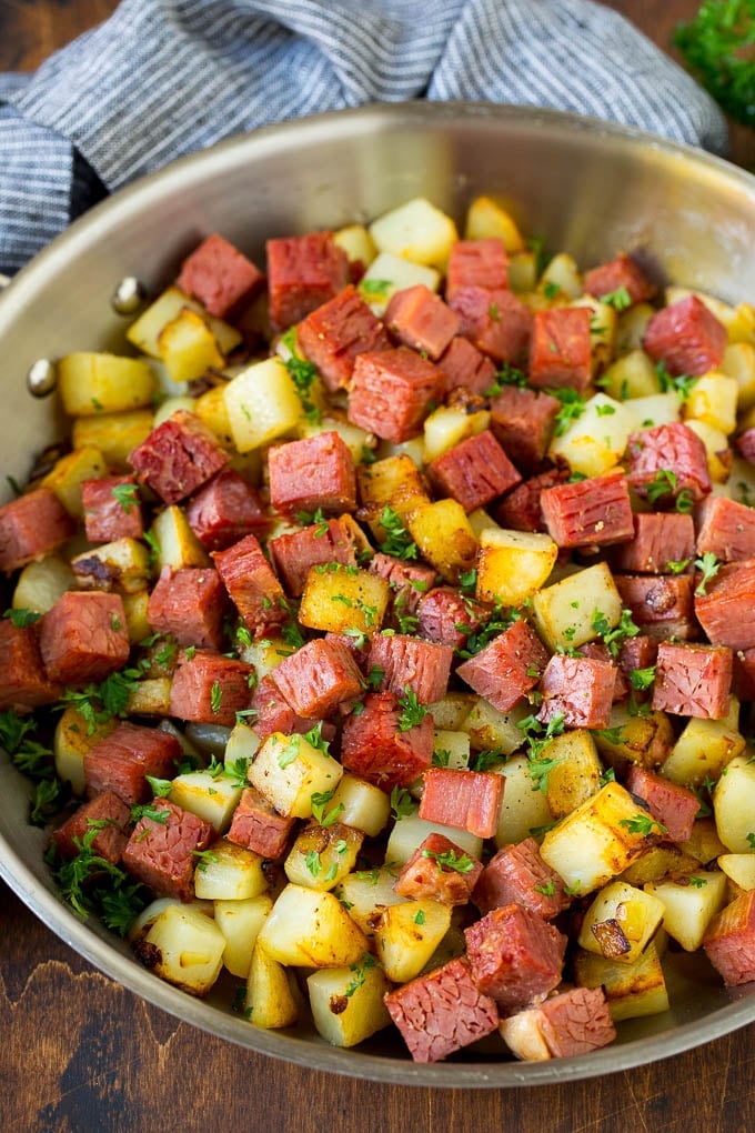 Corned Beef Hash Recipe #hash #cornedbeef #stpatricksday #breakfast #brunch #potatoes #edsug Corned beef hash with potatoes, onions and fresh herbs.