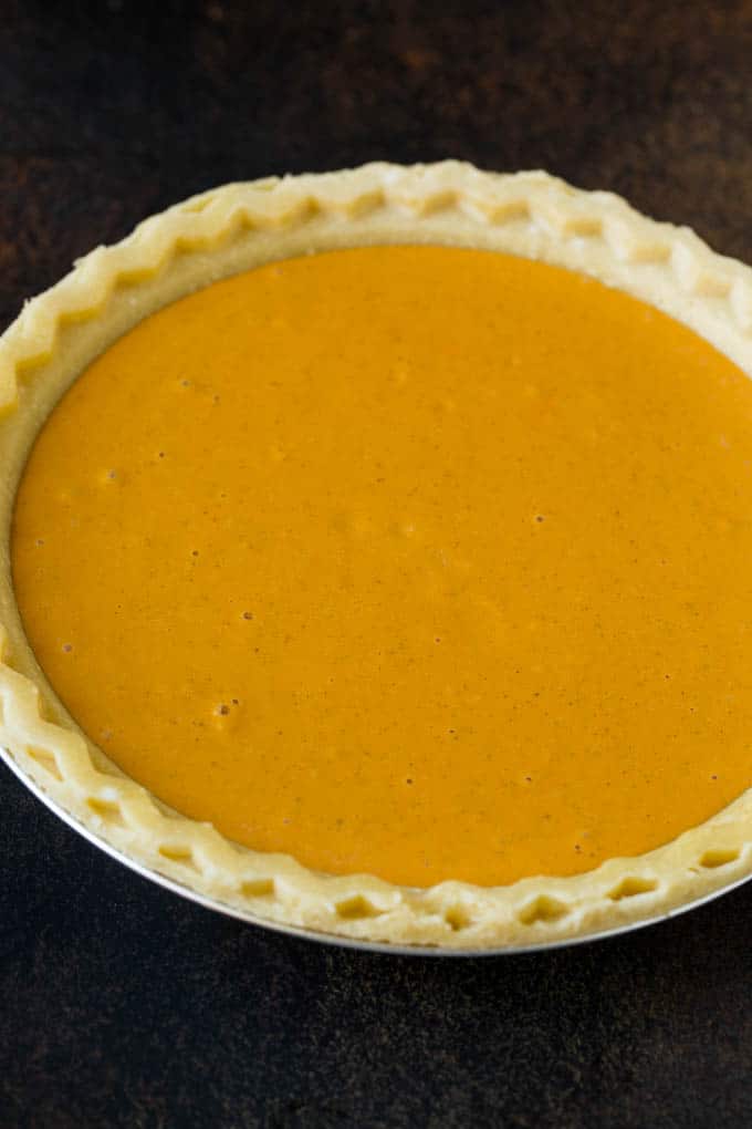 Homemade Pumpkin Pie Recipe | Pumpkin Pie #pie #pumpkin #baking #thanksgiving #fall #dessert #edsug Pie filling inside a pie crust.