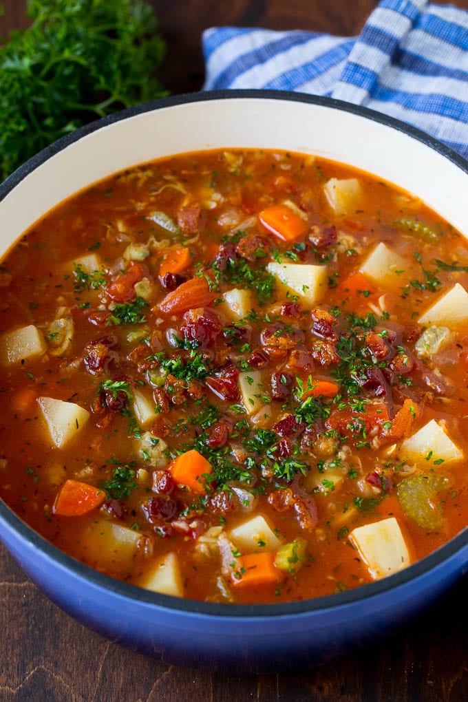 Manhattan clam chowder with tomatoes, potatoes, vegetables and bacon.