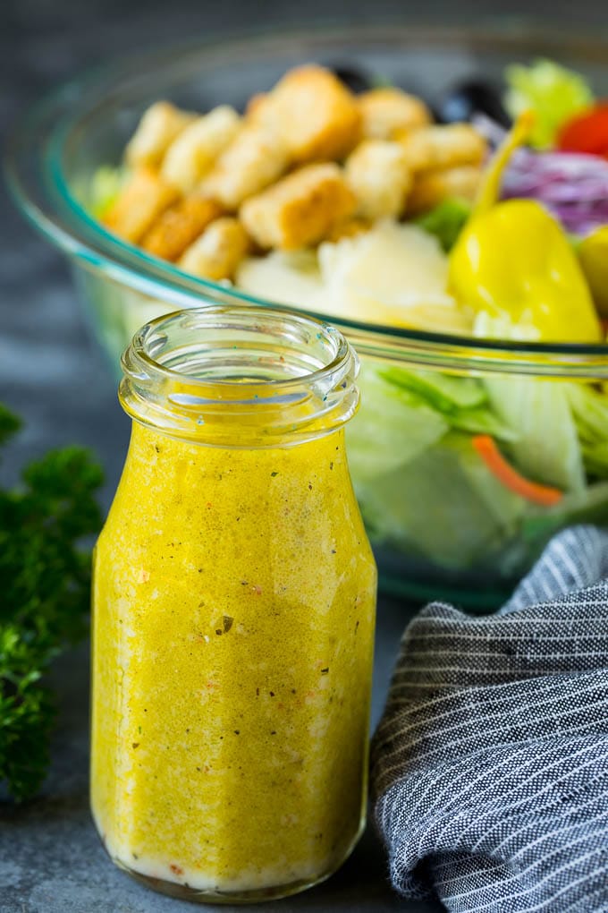 Olive Garden Salad Recipe | Italian Salad #salad #lettuce #olives #sidedish #dinner #edsug A bottle of homemade salad dressing.