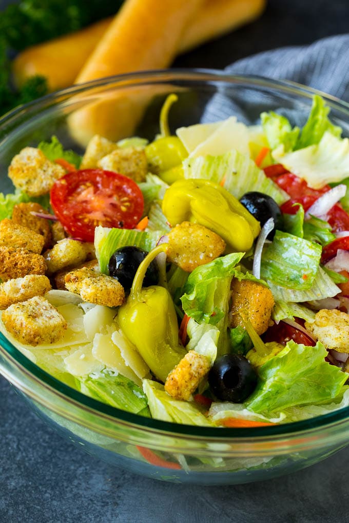 Olive Garden Salad Recipe | Italian Salad #salad #lettuce #olives #sidedish #dinner #edsug A tossed Olive Garden salad with Italian dressing, vegetables and olives.