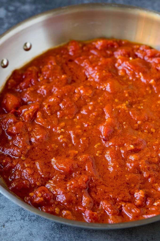Pasta Puttanesca Recipe #pasta #tomatoes #olives #italianfood #dinner #edsug Homemade tomato sauce in a skillet.