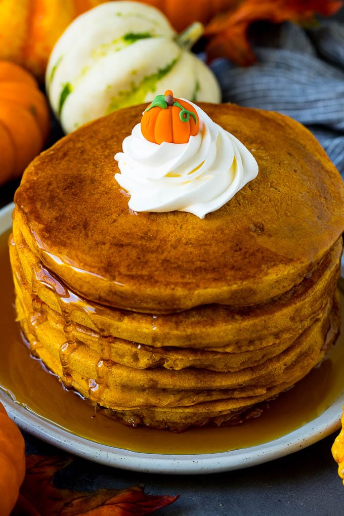 These pumpkin pancakes are light and fluffy buttermilk hotcakes flavored with pumpkin puree and spices. Pumpkin pancakes topped with maple syrup and whipped cream.