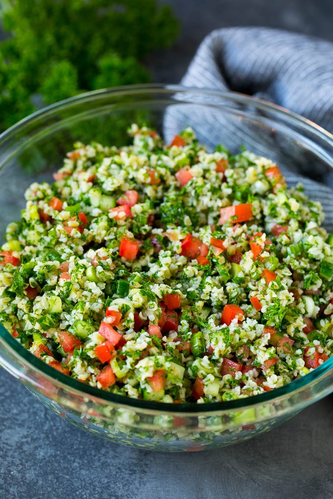 Tabbouleh Salad | Tabouli #salad #wheat #tomatoes #cucumber #healthy #sidedish #dinner #edsug A serving bowl filled with tabbouleh salad.