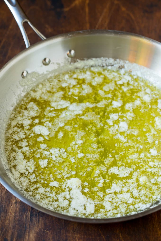 Garlic and Herb Angel Hair Pasta #pasta #garlic #sidedish #dinner #edsug Melted butter with garlic and olive oil in a pan.