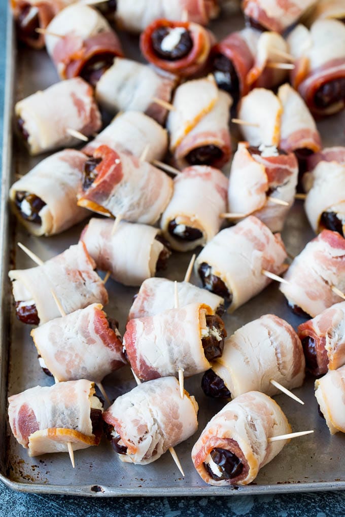 Bacon Wrapped Dates #appetizer #bacon #dates #cheese #edsug Dates wrapped in bacon and secured with toothpicks.
