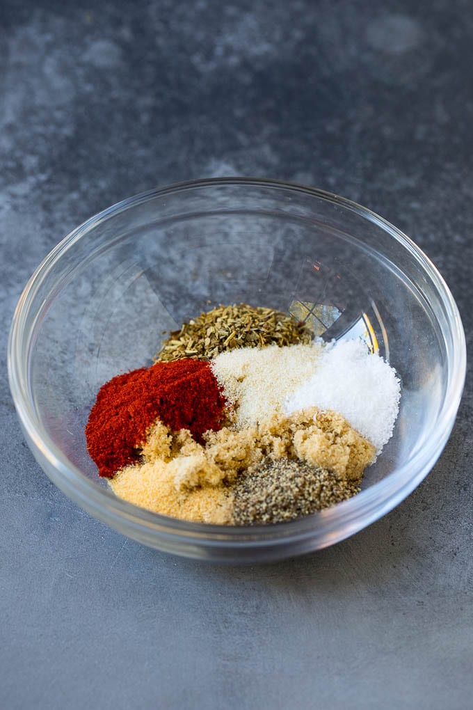 Baked Chicken Breast Recipe #chicken #dinner #edsug Herbs and seasonings in a mixing bowl.