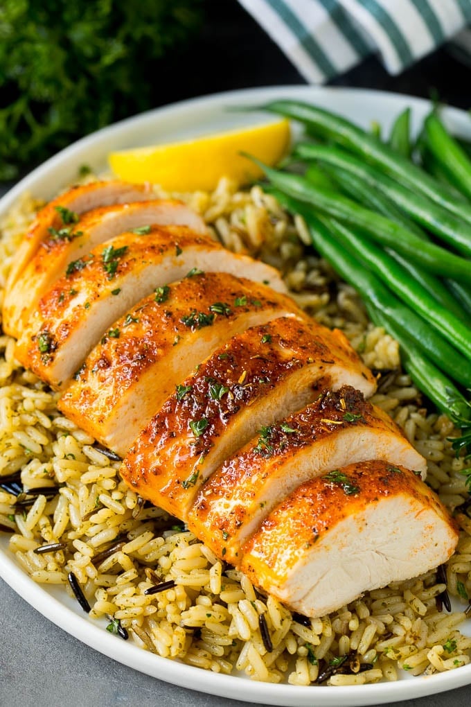 Baked Chicken Breast Recipe #chicken #dinner #edsug Baked chicken breast served with rice and green beans.