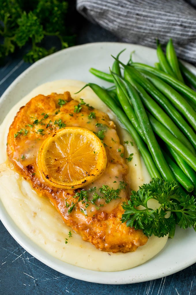 Chicken Francese Recipe #chicken #lemon #dinner #edsug Chicken francese served over mashed potatoes with green beans.