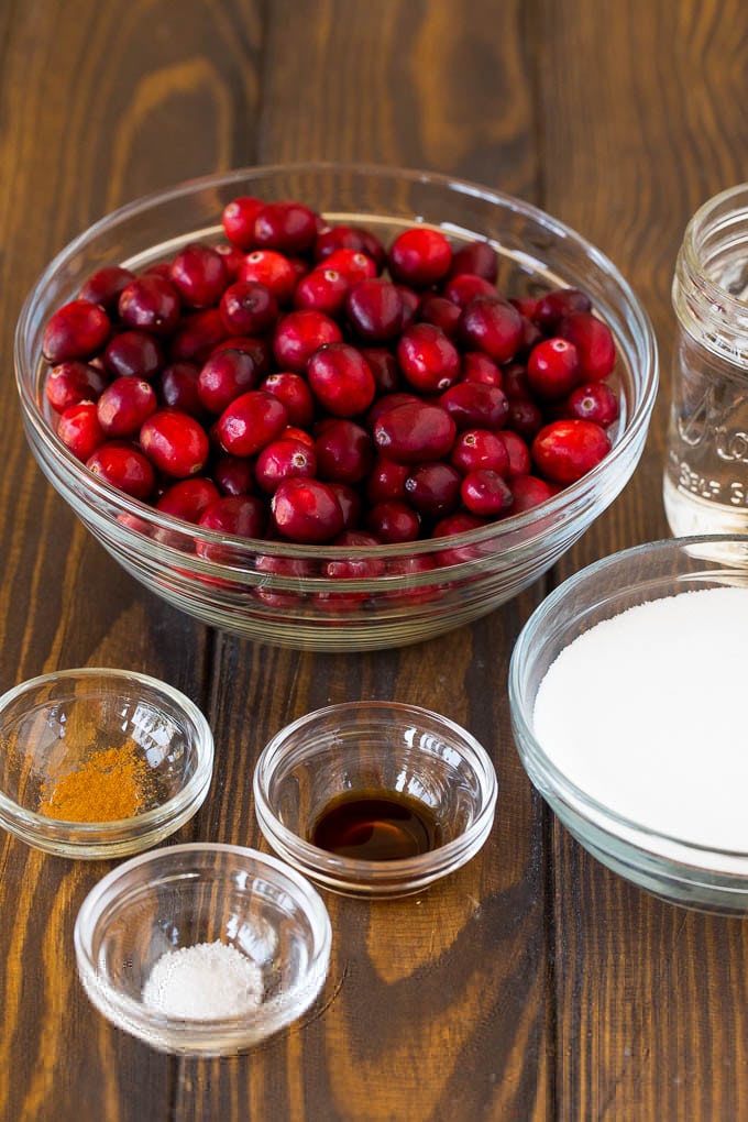 This homemade cranberry sauce is a 6 ingredient recipe that's made with fresh cranberries, sugar and a hint of spice. Bowls of cranberries, sugar and seasonings.