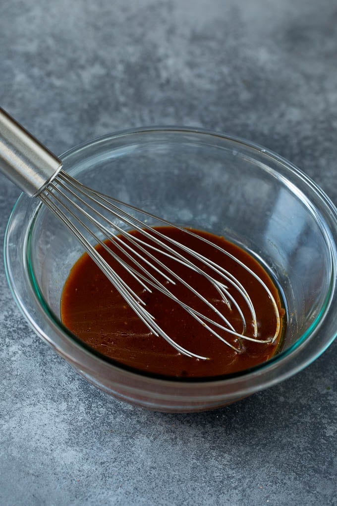 Asian Slaw Recipe #salad #slaw #sidedish #edsug A bowl of homemade sesame ginger dressing.
