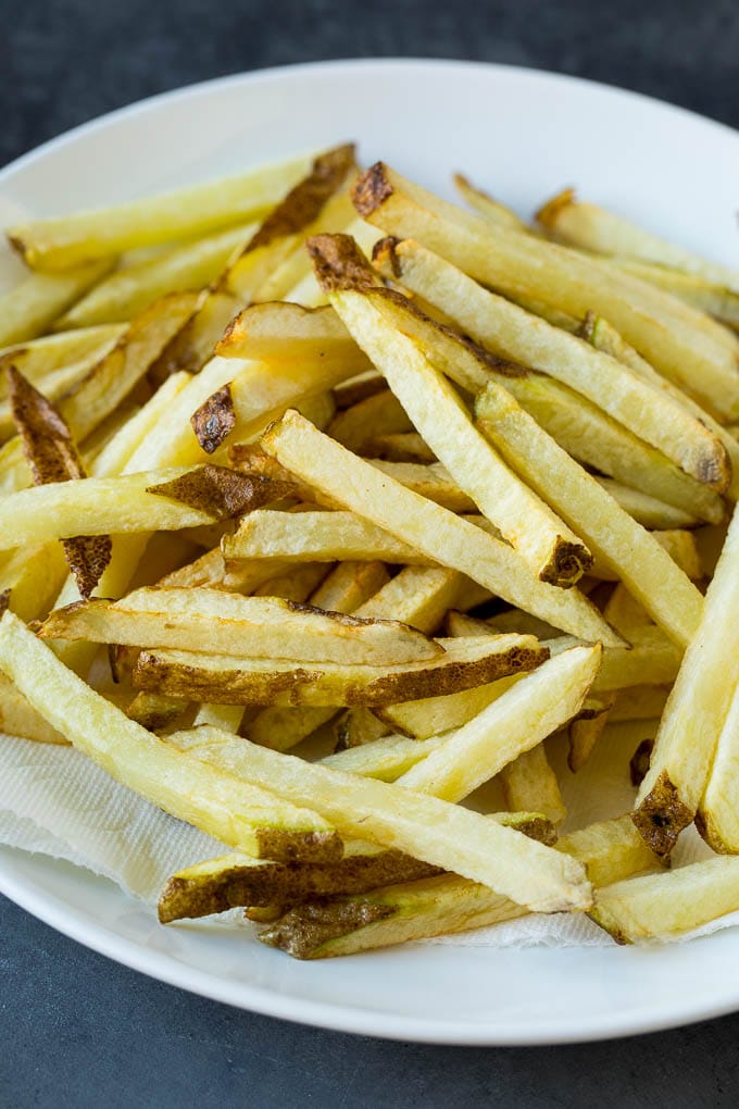 Homemade French Fries Recipe #potatoes #fries #dinner #edsug Par-fried potatoes on a plate.