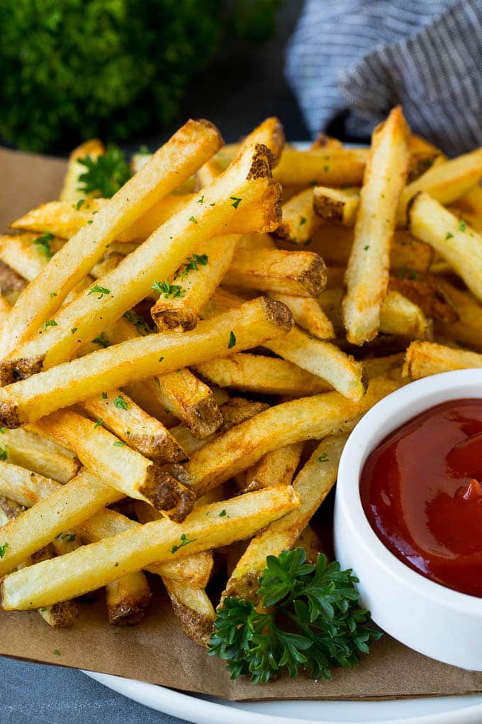 Homemade French Fries Recipe #potatoes #fries #dinner #edsug A plate of homemade french fries served with a bowl of ketchup.