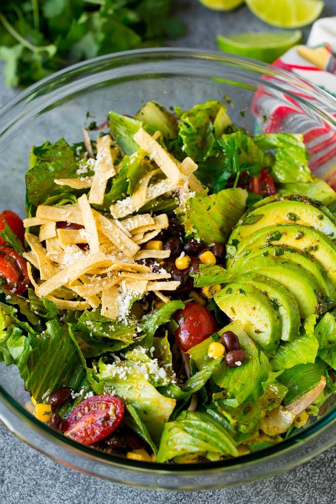 Mexican Salad Recipe #salad #corn #beans #avocado #tomatoes #edsug Mexican salad with lettuce, corn, beans and tomato, tossed in a lime dressing.