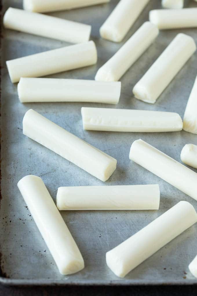 Mozzarella Sticks Recipe #cheese #appetizer #edsug Cheese sticks on a sheet pan.