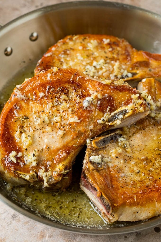 Pork coated in garlic and herb butter.