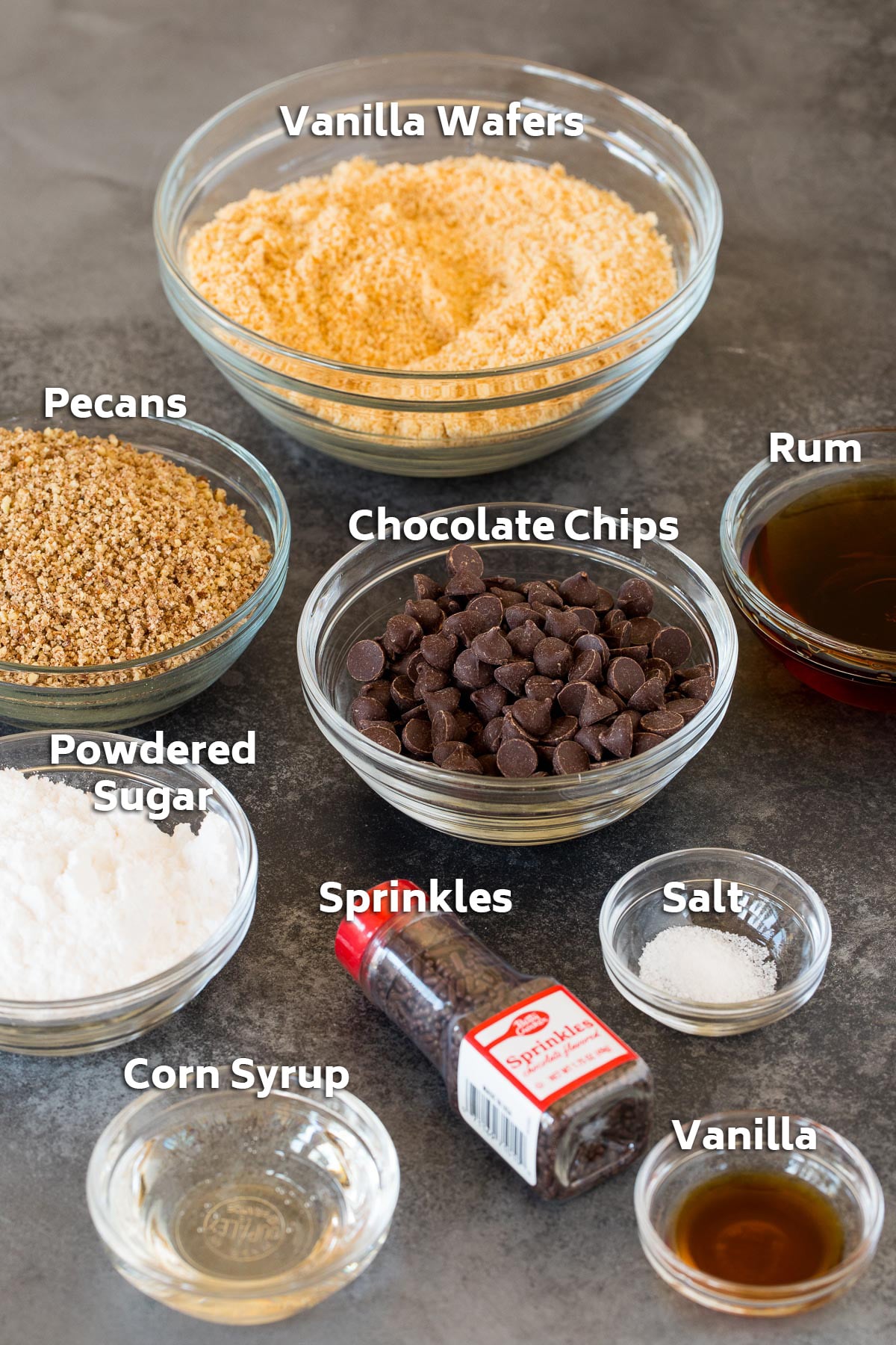 Bowls of ingredients including cookies, nuts, chocolate and flavorings.