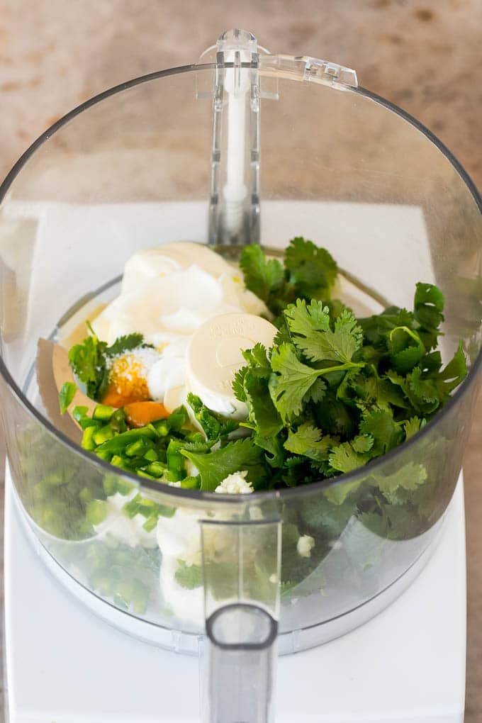Mayonnaise, sour cream, cilantro and seasonings in a food processor.