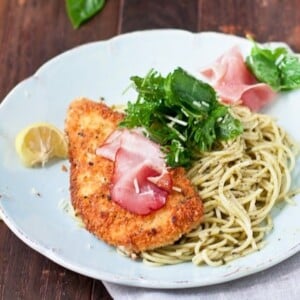 An image of chicken Bellagio on a bed of noodles.