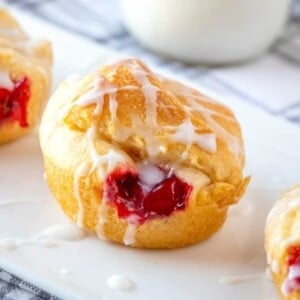 An image of a cherry pie bite on a plate.