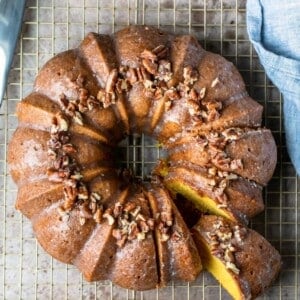 An image of an Irish cream Bundt cake with a slice removed.