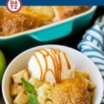 A picture of an apple cobbler which is an old fashioned dessert made with an apple filling that is topped with sweet buttermilk biscuits.