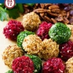 Cheese ball bites on a board which are the perfect elegant appetizer for any gathering.